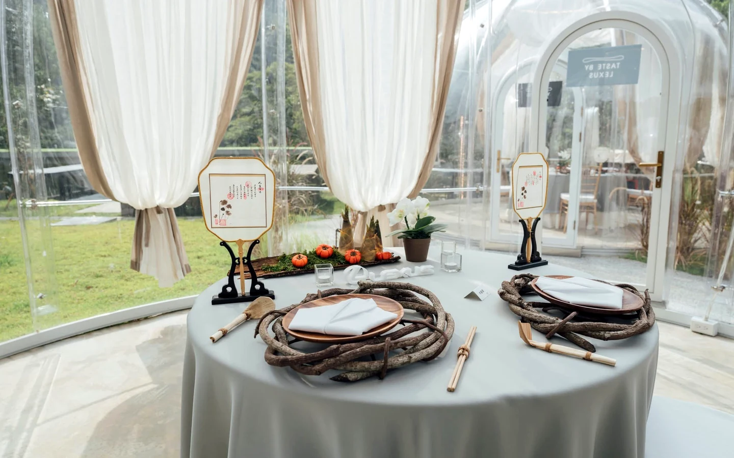 Table set for dining inside a Celenest dome with sheer curtains