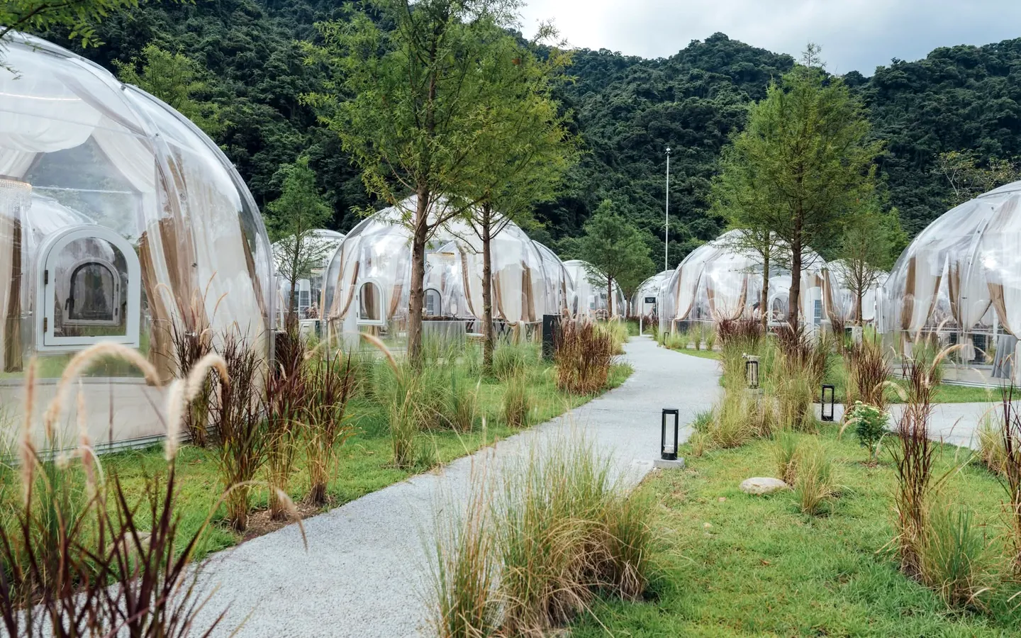 Celenest domes along a landscaped resort path