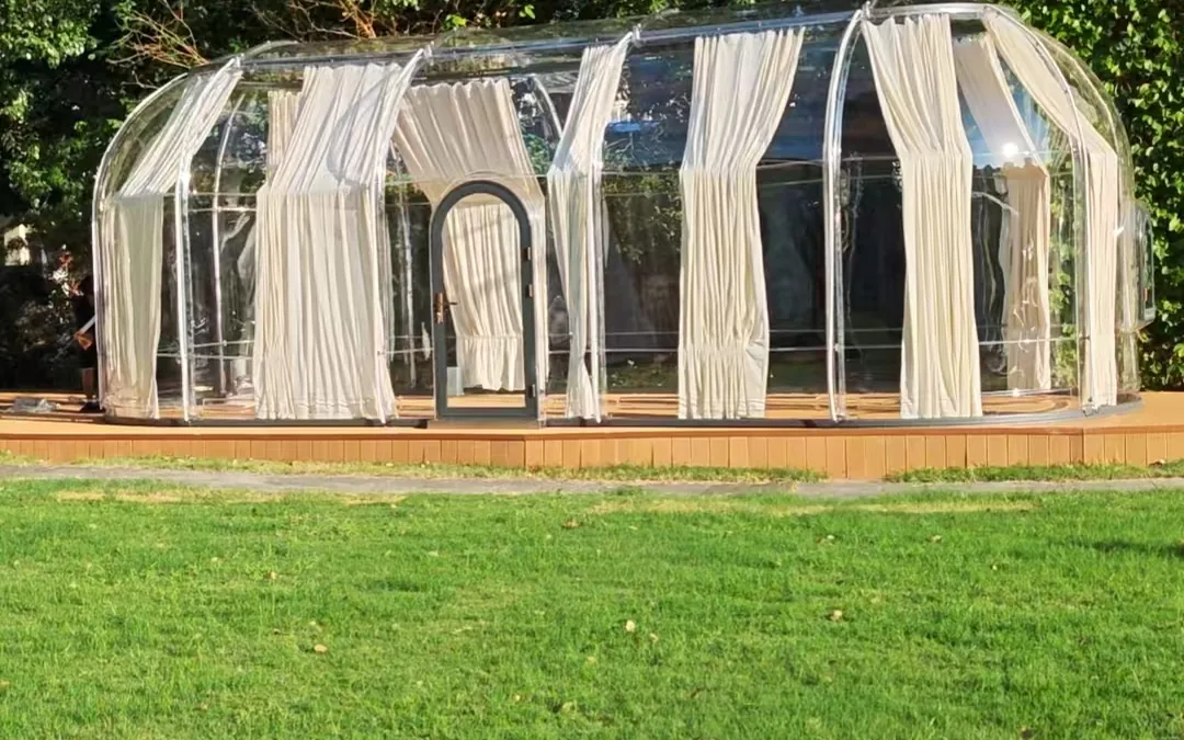 Extended transparent Celenest dome installed on a lawn