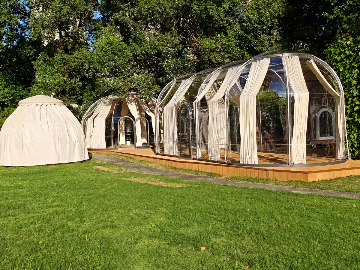 Extended oval Celenest dome on a timber deck and lawn